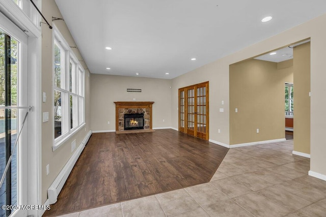 65 Pineoaka Rd, Jackson, NJ 08527 - unfurnished living room with a healthy amount of sunlight, recessed lighting, and a stone fireplace
