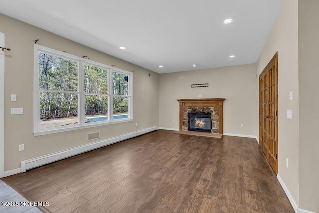 65 Pineoaka Rd, Jackson, NJ 08527 - unfurnished living room featuring a fireplace, baseboard heating, wood finished floors, baseboards, and recessed lighting