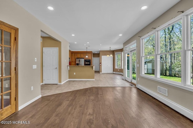 65 Pineoaka Rd, Jackson, NJ 08527 - unfurnished living room featuring recessed lighting, baseboards, light wood-style flooring, and a baseboard radiator
