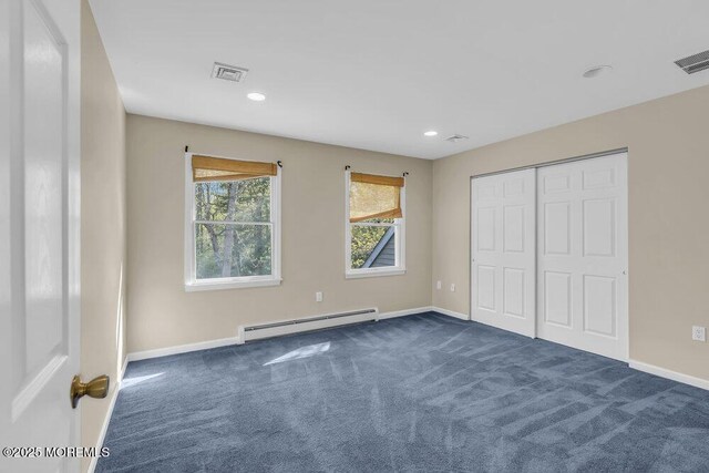 65 Pineoaka Rd, Jackson, NJ 08527 - unfurnished bedroom featuring baseboards, a baseboard heating unit, visible vents, and dark colored carpet