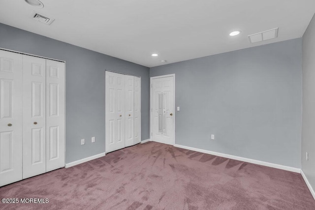 65 Pineoaka Rd, Jackson, NJ 08527 - unfurnished bedroom featuring two closets, baseboards, visible vents, and carpet