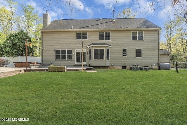 65 Pineoaka Rd, Jackson, NJ 08527 - back of house with a patio, fence, a yard, and a chimney