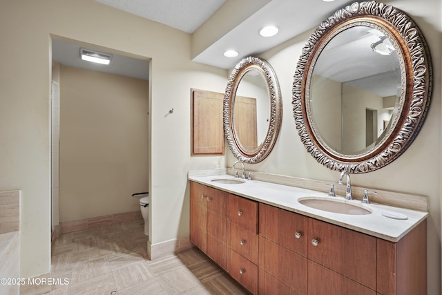 717 Ocean Ave Unit 512, Long Branch, NJ 07740 - bathroom with toilet, baseboards, double vanity, and recessed lighting