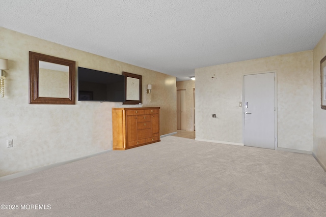 717 Ocean Ave Unit 512, Long Branch, NJ 07740 - unfurnished living room with a textured ceiling, baseboards, and carpet floors