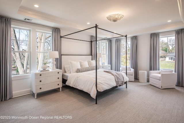 bedroom featuring crown molding, a raised ceiling, carpet, and recessed lighting