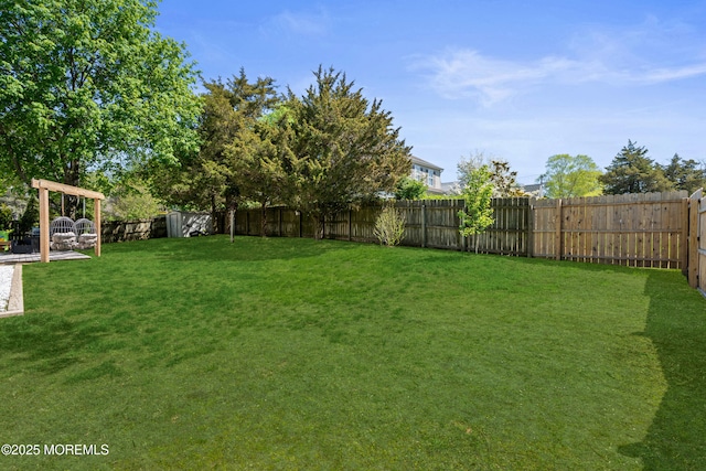 view of yard featuring a fenced backyard