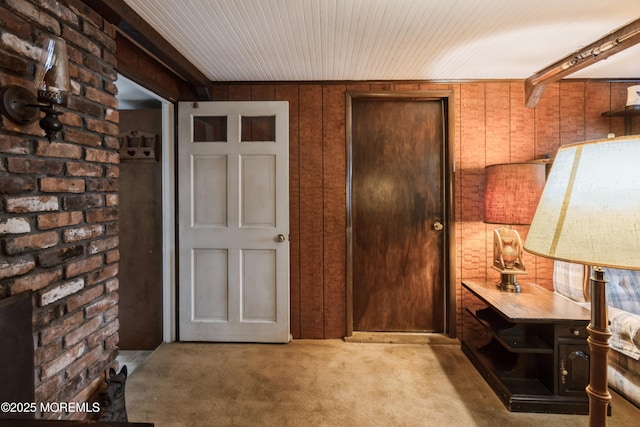 2174 Begonia Ave, Sea Girt, NJ 08750 - entryway featuring carpet flooring, brick wall, and wood walls