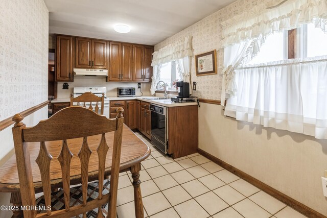 2174 Begonia Ave, Sea Girt, NJ 08750 - kitchen featuring wallpapered walls, under cabinet range hood, electric stove, dishwasher, and a sink