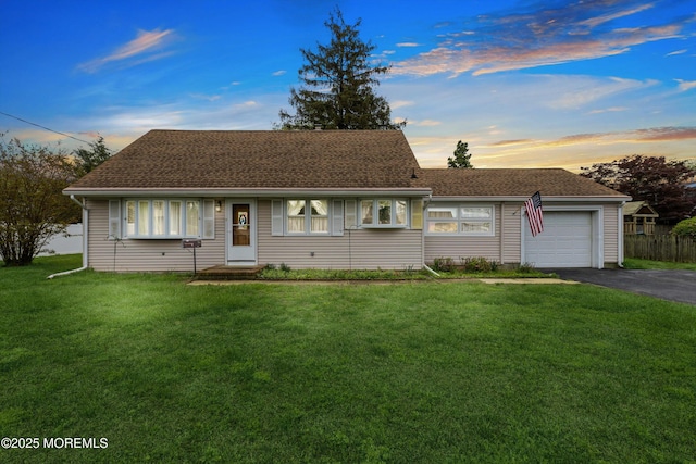 2174 Begonia Ave, Sea Girt, NJ 08750 - view of front of home featuring asphalt driveway, a garage, a yard, and roof with shingles