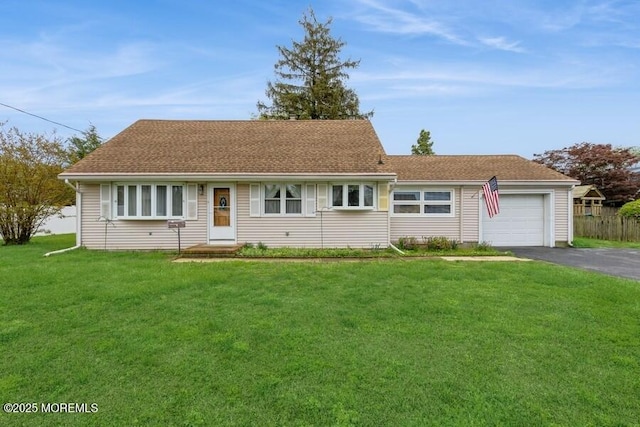 2174 Begonia Ave, Sea Girt, NJ 08750 - view of front of house featuring asphalt driveway, an attached garage, and a front yard