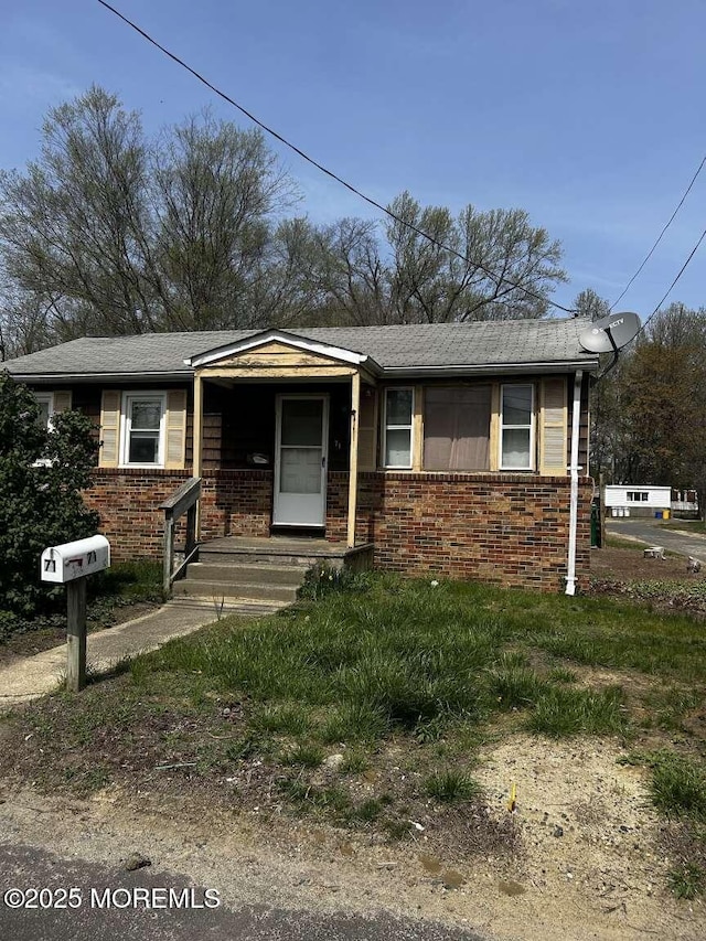 view of front of property featuring brick siding