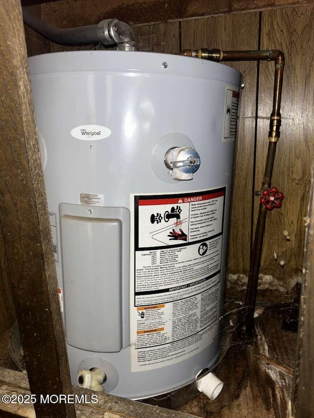 utility room with electric water heater