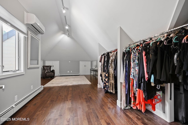 spacious closet featuring a wall mounted AC, baseboard heating, vaulted ceiling, wood finished floors, and a baseboard heating unit