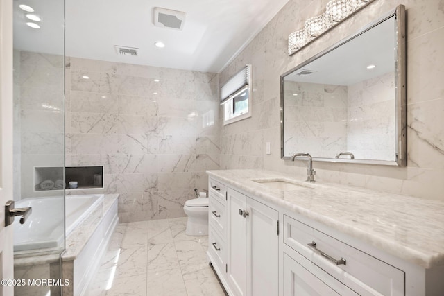 bathroom featuring a garden tub, visible vents, tile walls, toilet, and marble finish floor