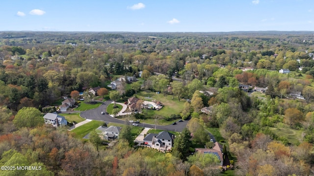 drone / aerial view with a view of trees