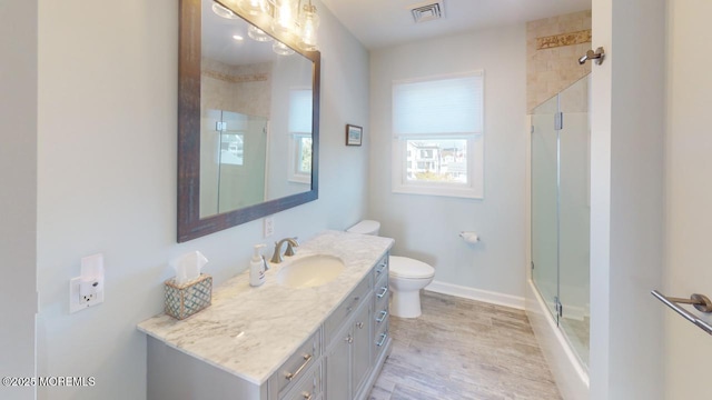 12 23rd Ave, South Seaside Park, NJ 08752 - bathroom with a shower stall, wood finished floors, vanity, and toilet