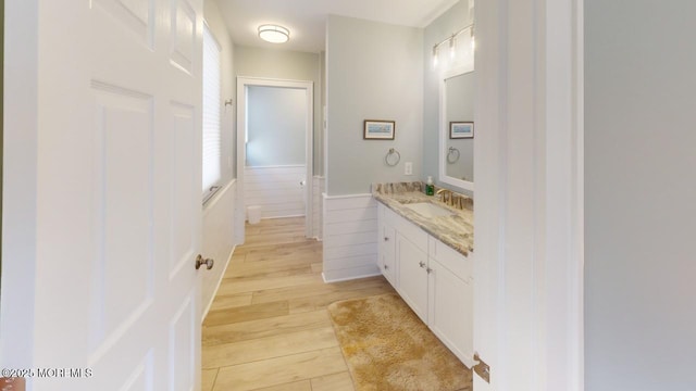 12 23rd Ave, South Seaside Park, NJ 08752 - bathroom featuring vanity, wood finished floors, and a wainscoted wall