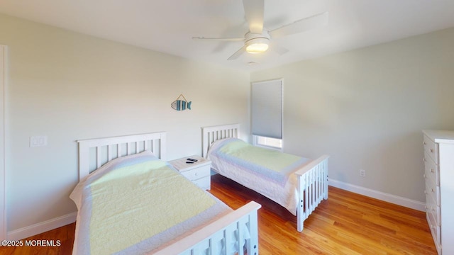 12 23rd Ave, South Seaside Park, NJ 08752 - bedroom with baseboards, wood finished floors, and ceiling fan
