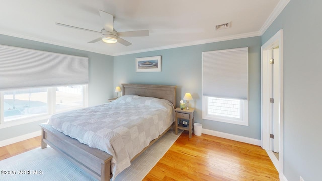 12 23rd Ave, South Seaside Park, NJ 08752 - bedroom with light wood-style floors, baseboards, crown molding, and a ceiling fan