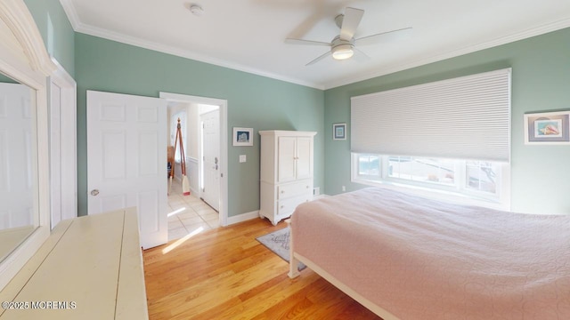 12 23rd Ave, South Seaside Park, NJ 08752 - bedroom featuring crown molding, light wood-style flooring, a ceiling fan, and baseboards