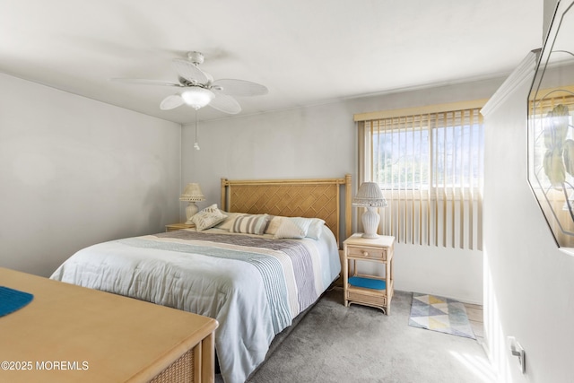bedroom with ceiling fan and carpet