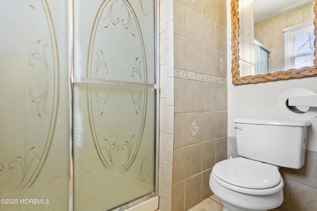 full bath featuring tile walls, a shower stall, and toilet