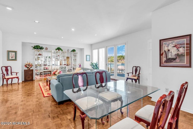 dining room with recessed lighting and baseboards