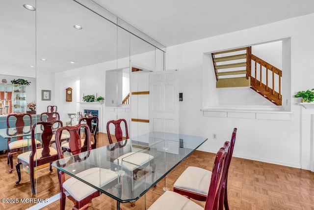 dining area featuring stairs, recessed lighting, and baseboards