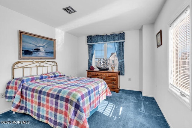 bedroom with carpet flooring, baseboards, and visible vents