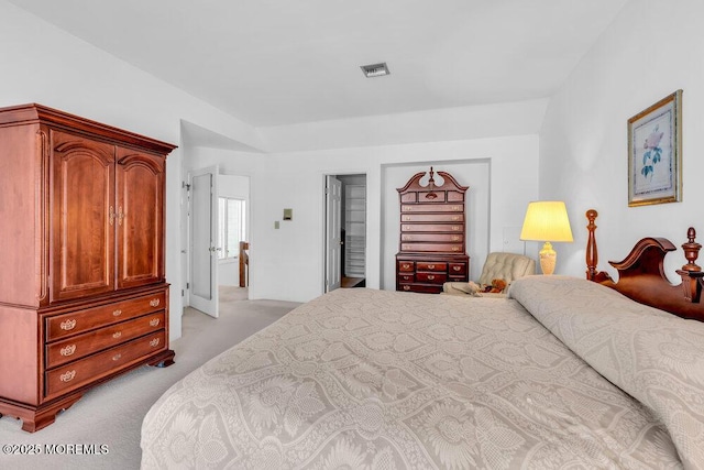 bedroom with light colored carpet and visible vents