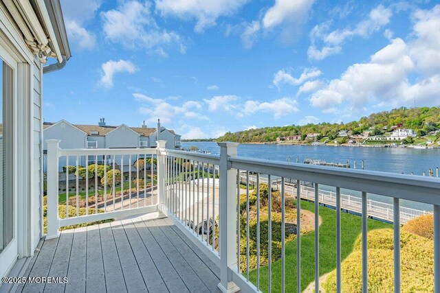 balcony featuring a water view