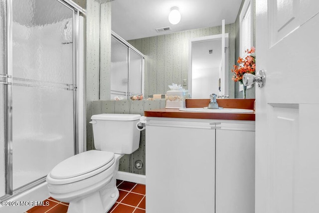 bathroom with visible vents, a stall shower, tile patterned floors, toilet, and wallpapered walls