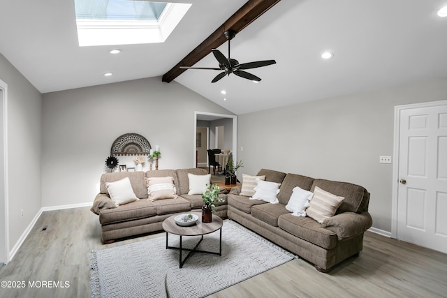 living room with recessed lighting, ceiling fan, wood finished floors, and lofted ceiling with skylight