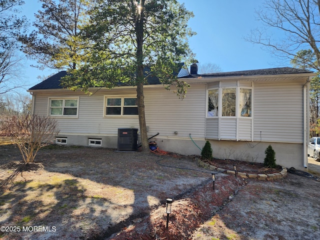 517 Newtons Corner Rd, Howell, NJ 07731 - rear view of house featuring a chimney and central AC