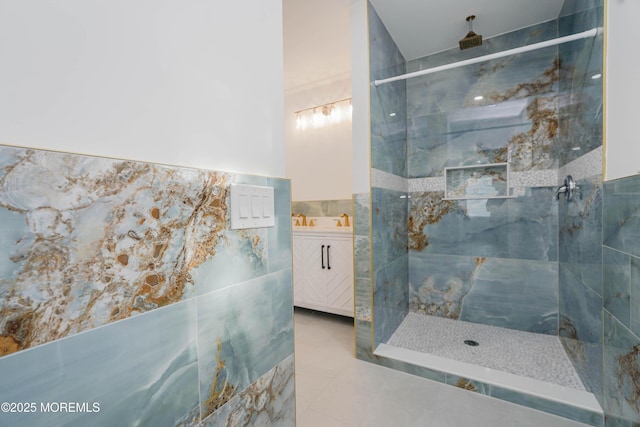 bathroom with walk in shower, tile patterned floors, and vanity