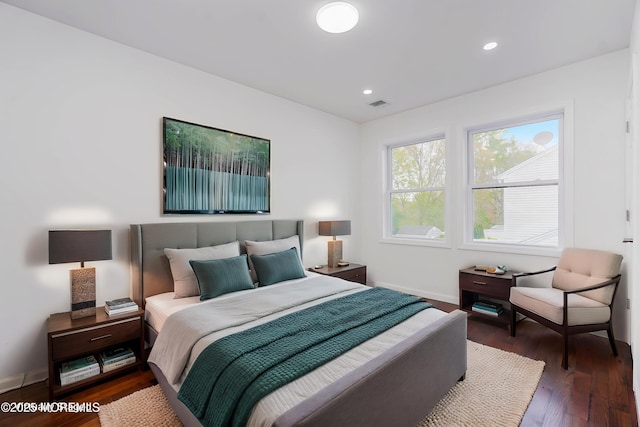 bedroom featuring recessed lighting, visible vents, wood finished floors, and baseboards