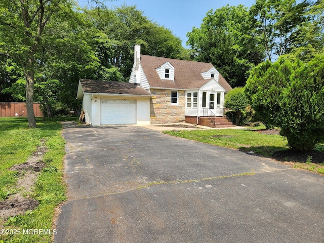 41 Willow Ave, Howell, NJ 07731 - cape cod-style house with asphalt driveway, a chimney, a garage, and stone siding