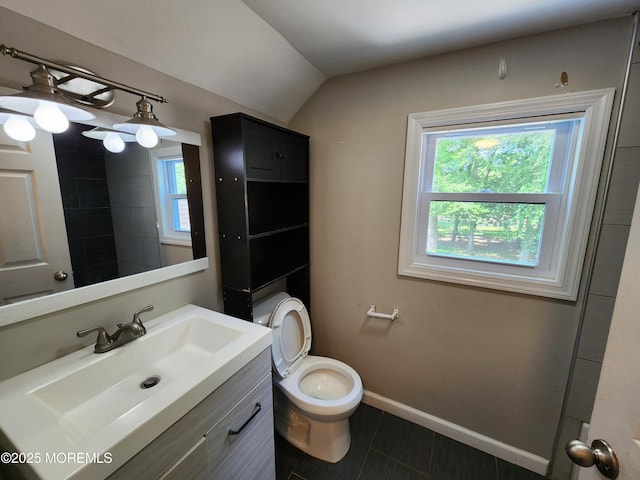 41 Willow Ave, Howell, NJ 07731 - bathroom with vanity, lofted ceiling, toilet, baseboards, and tile patterned floors