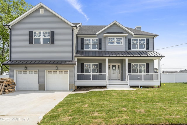 view of front of house featuring a standing seam roof, a porch, driveway, and a front lawn