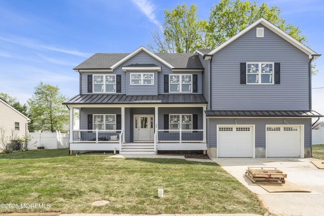 view of front of property with a standing seam roof, concrete driveway, a porch, and a garage