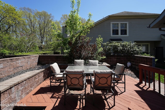 deck with outdoor dining area