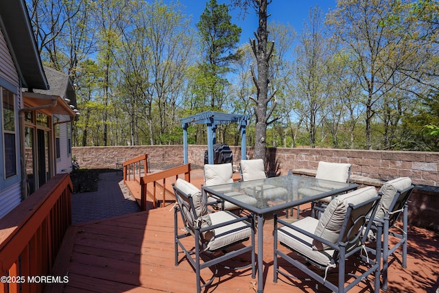 deck featuring outdoor dining area