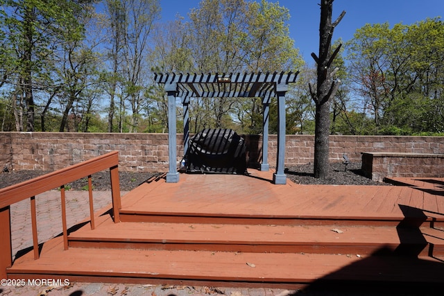 wooden deck with fence and a pergola