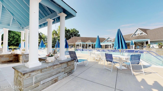 view of patio featuring a community pool
