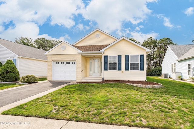 ranch-style house featuring central AC unit, a garage, brick siding, aphalt driveway, and a front lawn