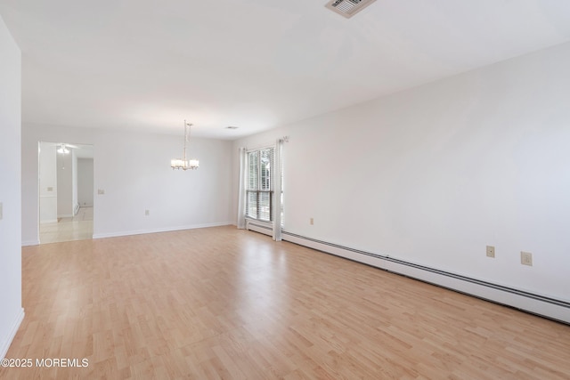 unfurnished room featuring visible vents, baseboards, ceiling fan with notable chandelier, a baseboard heating unit, and light wood-style flooring