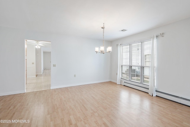 unfurnished room featuring visible vents, ceiling fan with notable chandelier, baseboards, light wood-type flooring, and a baseboard heating unit
