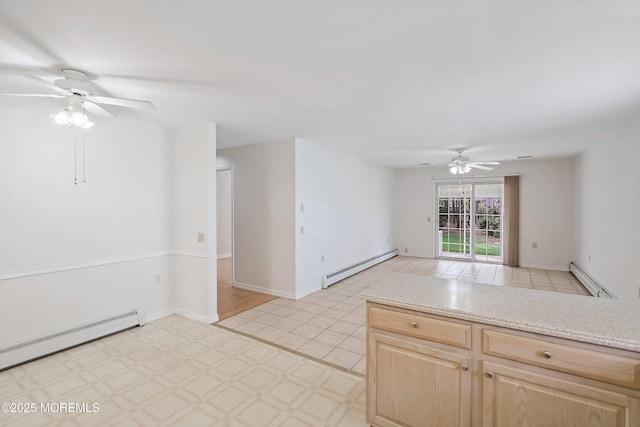 spare room featuring baseboards, a baseboard radiator, a ceiling fan, and a baseboard heating unit