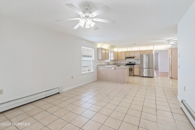 kitchen featuring ceiling fan, a sink, baseboard heating, stainless steel appliances, and under cabinet range hood