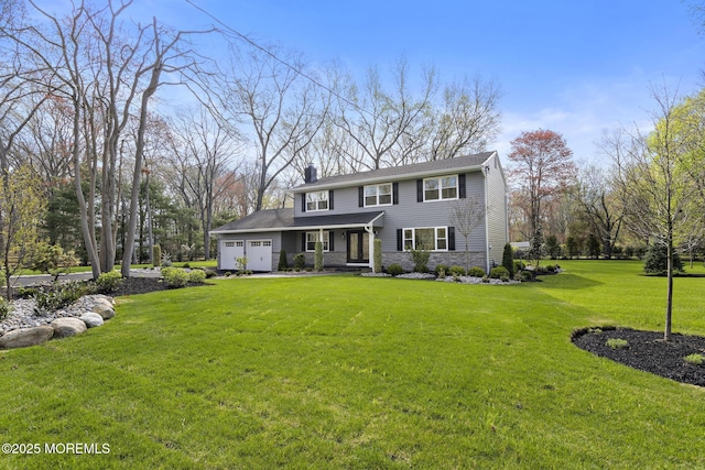traditional-style house featuring a chimney, a garage, a front yard, and stone siding